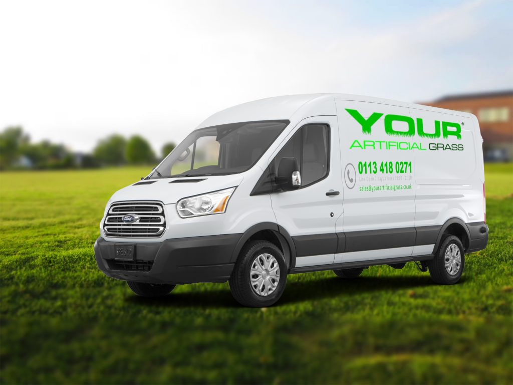 The company's delivery van parked on grass.